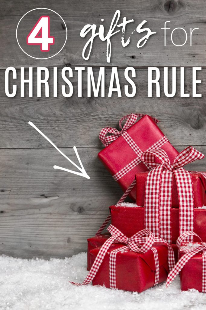 red Christmas gifts stacked up on fake snow